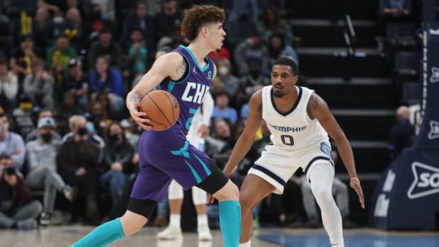 Nov 10, 2021; Memphis, Tennessee, USA; Charlotte Hornets guard LaMelo Ball (2) dribbles as Memphis Grizzles guard De'Anthony Melton (0) defends during the second half at FedExForum. Mandatory Credit: Petre Thomas-USA TODAY Sports